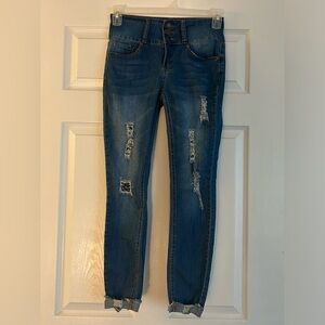 Blue denim ripped jeans with patches underneath